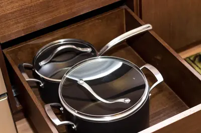 a pair of pans sitting in a drawer at Pet Friendly 2 Bedroom and 2 Bathroom Apartment near Rittenhouse apts in Philadelphia