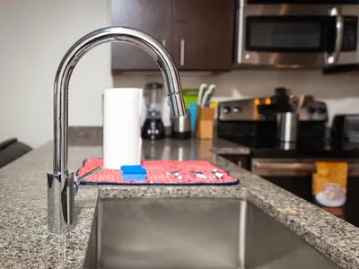 a kitchen sink with a faucet and a counter at Pet Friendly 2 Bedroom and 2 Bathroom Apartment near Rittenhouse apts in Philadelphia
