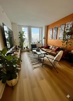 a living room with a couch and a table at LES is MORE stunning views in New York