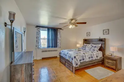 a bedroom with a bed and a ceiling fan at Quaint Lansdowne Getaway Near Downtown Philly! in Lansdowne