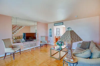 a living room with a couch and chairs and a tv at Quaint Lansdowne Getaway Near Downtown Philly! in Lansdowne