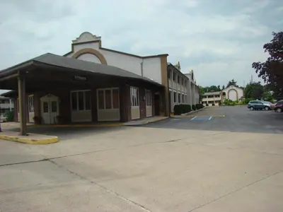 an empty parking lot in front of a building at Aderi Hotel Lewisburg in Lewisburg