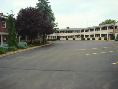 an empty parking lot in front of a building at Aderi Hotel Lewisburg in Lewisburg