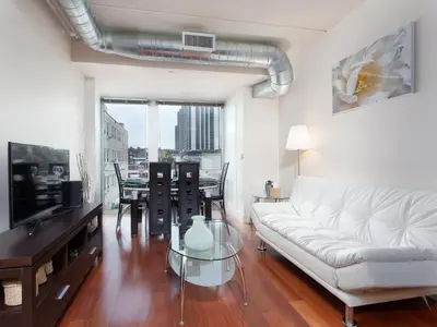 a living room with a white couch and a table at 2BR 1BA Apartment near Rittenhouse Square apts in Philadelphia