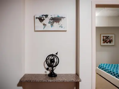 a room with a map of the world on the wall at 2BR 1BA Apartment near Rittenhouse Square apts in Philadelphia