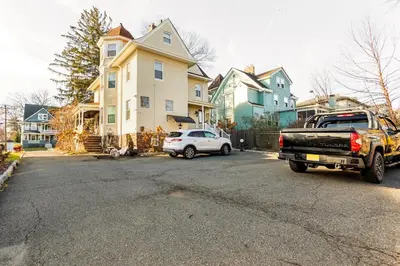 a truck parked in front of a house at Sunny & Spacious Montclair NJ Apartment in Montclair