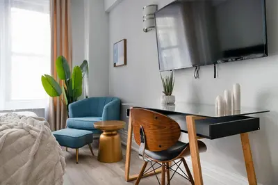 a living room with a desk and two chairs at 73-1204 New Studio UWS Doorman Gym in New York