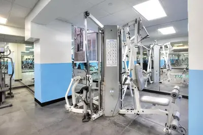 a gym with several machines in a room at 73-1204 New Studio UWS Doorman Gym in New York