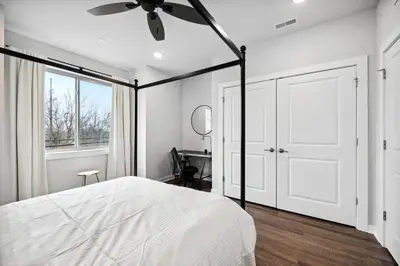 a bedroom with a bed and a ceiling fan at Luxurious Condo with Rooftop and Parking near University City in Philadelphia