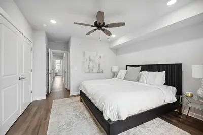 a bedroom with a bed and a ceiling fan at Luxurious Condo with Rooftop and Parking near University City in Philadelphia