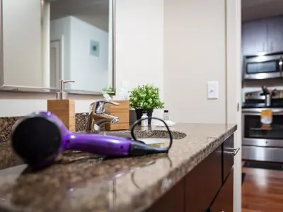 a purple brush sitting on a counter in a kitchen at Furnished Apartment near Rittenhouse Square apts in Philadelphia