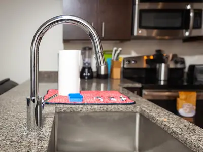 a kitchen sink with a faucet and a counter at Furnished Apartment near Rittenhouse Square apts in Philadelphia