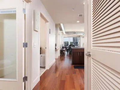a hallway with a door leading to a kitchen at Furnished Apartment near Rittenhouse Square apts in Philadelphia