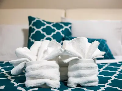 two towels sitting on top of a bed at Furnished Apartment near Rittenhouse Square apts in Philadelphia