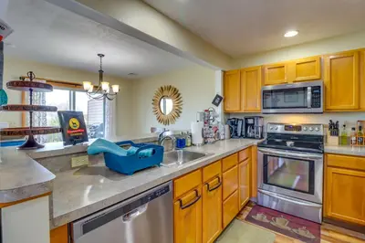 a kitchen with wooden cabinets and a sink at Tannersville Rental Near Camelback Ski Resort! in Tannersville