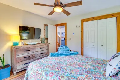 a bedroom with a bed and a ceiling fan at Tannersville Rental Near Camelback Ski Resort! in Tannersville