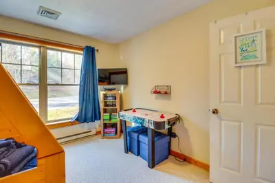 a room with a bed and a table in it at Tannersville Rental Near Camelback Ski Resort! in Tannersville