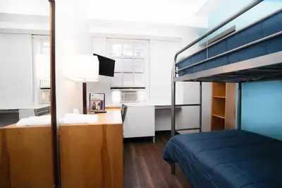 a small bedroom with a bunk bed and a desk at West Side YMCA in New York