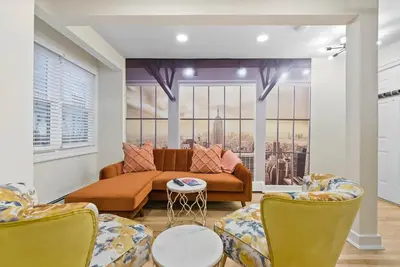 a living room with a couch and two chairs at 10Min to NYC - 2BR/2.5Bath-3Beds-Free Parking-No Chores in Hoboken