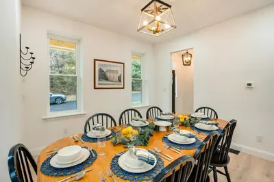 a dining room with a wooden table and chairs at Family-Friendly Hatfield Home 3 Mi to Downtown! in Hatfield