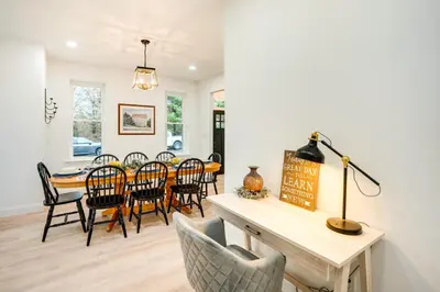 a dining room and living room with a table and chairs at Family-Friendly Hatfield Home 3 Mi to Downtown! in Hatfield