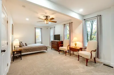 a bedroom with a bed and a desk and chairs at Family-Friendly Hatfield Home 3 Mi to Downtown! in Hatfield