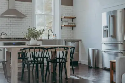 a kitchen with a table and chairs in a kitchen at 1900's Historic Lancaster School House in Willow Street