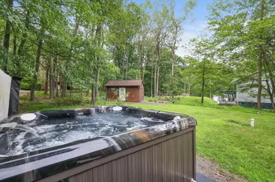 a hot tub in a yard with a gazebo at Weekend at Bernie's! *Pet friendly!* **Hot tub** in Long Pond