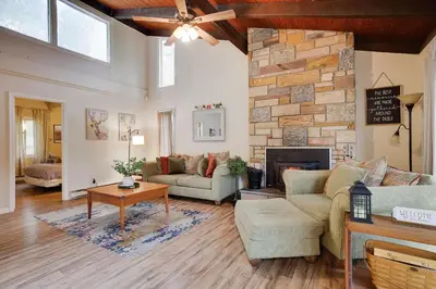 a living room with a couch and a fireplace at Weekend at Bernie's! *Pet friendly!* **Hot tub** in Long Pond