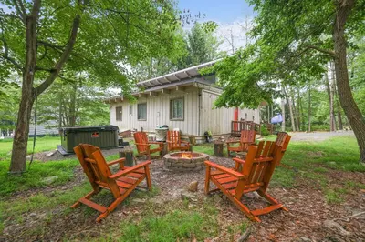 a group of chairs sitting around a fire pit at Weekend at Bernie's! *Pet friendly!* **Hot tub** in Long Pond