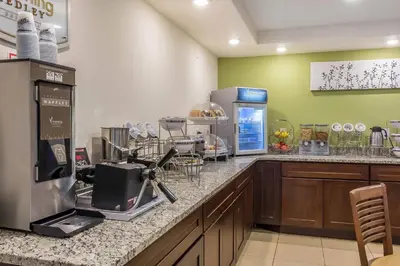 a kitchen with a counter top with a coffee shop at Sleep Inn Philadelphia Center City in Philadelphia