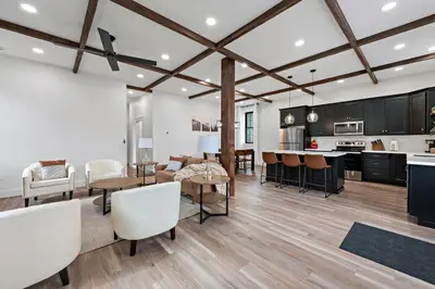 a kitchen and living room with a table and chairs at Riverview in Port Clinton - Apt A in Port Clinton
