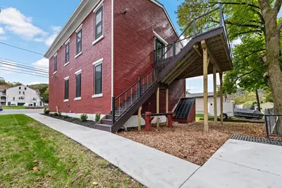 a staircase on the side of a red brick building at Riverview in Port Clinton - Apt. B in Port Clinton