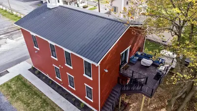 an overhead view of a red house with a balcony at Riverview in Port Clinton - Apt. B in Port Clinton