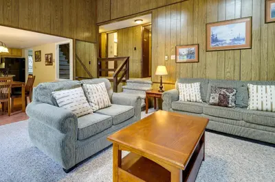 a living room with two couches and a coffee table at Fire Pit Arrowhead Lake Vacation Rental! in Pocono Lake