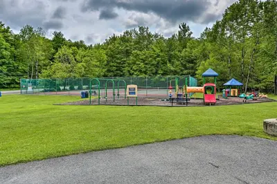 a park with a playground with a playground at Fire Pit Arrowhead Lake Vacation Rental! in Pocono Lake