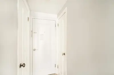 a white closet with a door in a room at 73-1004 New Studio UWS Doorman Gym in New York