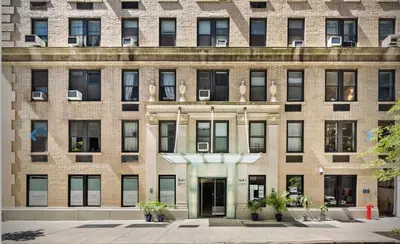 a large brick building with a door in front at 73-1004 New Studio UWS Doorman Gym in New York