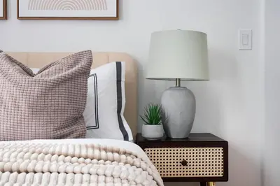 a bedroom with a bed and a lamp on a nightstand at 153-1G Newly Renovated 2BR Lower East Side in New York