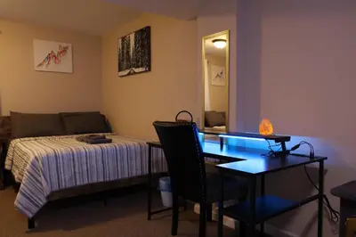 a bedroom with a bed and a desk and a table at Long pond, Pocono pines quiet & cozy!Kalahari 8mins in Pocono Pines