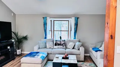 a living room with a couch and a table at Long pond, Pocono pines quiet & cozy!Kalahari 8mins in Pocono Pines