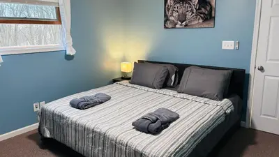 a bedroom with a bed with two towels on it at Long pond, Pocono pines quiet & cozy!Kalahari 8mins in Pocono Pines