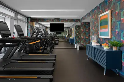 a gym with a row of treadmills at Financial District 1br w WD gym elevator NYC-1360 in New York