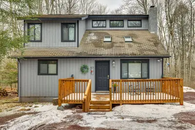 a house with two wooden decks in front of it at Pocono Pines Home with Private Hot Tub! in Pocono Pines