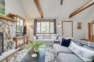 a living room with a couch and a fireplace at Pocono Pines Home with Private Hot Tub! in Pocono Pines