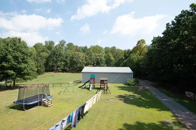 a park with a playground and a building at The Wren's Nest in Birdsboro