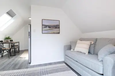 a living room with a couch and a table at The Wren's Nest in Birdsboro