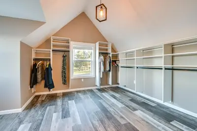 an attic room with walk in closets and a window at Family Home on Lake Newton with Deck and Fire Pit in Carbondale