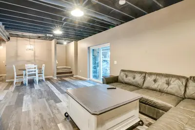 a living room with a couch and a table at Family Home on Lake Newton with Deck and Fire Pit in Carbondale