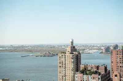 a view of a city with a river and a building at Financial District 1br w WD gym elevator NYC-1378 in New York